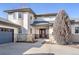 Front entrance of a large, well-kept home with a dark wood front door at 4405 Fairway Ln, Broomfield, CO 80023