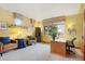 Bright living room with large windows, comfortable seating, and neutral carpet at 4405 Fairway Ln, Broomfield, CO 80023