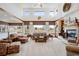Bright living room with large windows, cozy fireplace, and comfortable seating arrangement at 4405 Fairway Ln, Broomfield, CO 80023