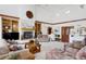 Bright living room with a fireplace and tall ceilings at 4405 Fairway Ln, Broomfield, CO 80023