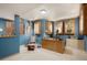 Spacious office with wood desk, natural light, wood shutters and custom display cases for military uniforms and memorabilia at 4405 Fairway Ln, Broomfield, CO 80023