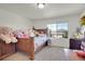 Bedroom with a window and a collection of stuffed animals on the bed at 4996 Cathay Ct, Denver, CO 80249