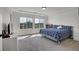 Sun-filled bedroom with large windows, plush carpet, and a comfortable bed at 4996 Cathay Ct, Denver, CO 80249