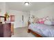Bedroom featuring a bed, dresser, and closet at 4996 Cathay Ct, Denver, CO 80249