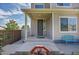 Charming front porch with a gray front door, a bench, and a well-kept lawn at 4996 Cathay Ct, Denver, CO 80249