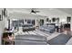 Spacious living room with neutral color palette, fireplace, recessed lighting, and windows offering natural light at 4996 Cathay Ct, Denver, CO 80249