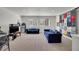 Spacious living room with carpet, two sofas, and bright natural light at 4996 Cathay Ct, Denver, CO 80249