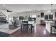 Open floor plan seamlessly connects the living room with the kitchen and dining area at 4996 Cathay Ct, Denver, CO 80249