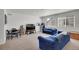 Comfortable living room featuring two sofas, a TV and a small refrigerator at 4996 Cathay Ct, Denver, CO 80249