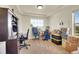 Bright home office with a large window and ample workspace at 4996 Cathay Ct, Denver, CO 80249