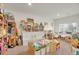 Spacious playroom with carpeted floors, white walls, and filled with toys at 4996 Cathay Ct, Denver, CO 80249