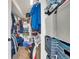Walk-in closet, well-organized with clothes and storage bins at 4996 Cathay Ct, Denver, CO 80249