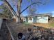 The backyard features a large tree, a patio, and a garden area at 2741 W 134Th Cir, Broomfield, CO 80020