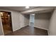 This basement features gray walls, brown floors, and access to the unfinished portion of the basement at 2741 W 134Th Cir, Broomfield, CO 80020