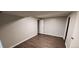 The basement has gray walls, brown floors, and white trim around the doors at 2741 W 134Th Cir, Broomfield, CO 80020
