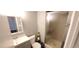 The bathroom has a sink with a white vanity and a shower with glass doors at 2741 W 134Th Cir, Broomfield, CO 80020