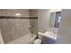 Updated bathroom with a shower-tub combo, modern vanity, and neutral tile at 2741 W 134Th Cir, Broomfield, CO 80020