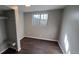 This bedroom has gray walls, brown floors, closet, and a window that lets in natural light at 2741 W 134Th Cir, Broomfield, CO 80020
