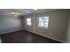 Neutral-toned bedroom with hardwood floors, bright windows, and recessed lighting at 2741 W 134Th Cir, Broomfield, CO 80020
