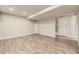 Spacious basement featuring durable flooring, neutral walls, and recessed lighting, offering versatility for various uses at 5645 S Himalaya Way, Centennial, CO 80015