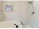 Clean and bright bathroom with a soaking tub, shower, and modern fixtures at 5645 S Himalaya Way, Centennial, CO 80015