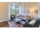Bright living room with large window, neutral color palette, and stylish decor at 5645 S Himalaya Way, Centennial, CO 80015