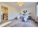 A comfortable main bedroom features soft carpet, neutral walls, and a large window at 5645 S Himalaya Way, Centennial, CO 80015