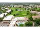 Aerial view showcasing the community, golf course, pool, and lush greenery at 695 S Alton Way # 9C, Denver, CO 80247