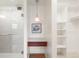 Spa-like bathroom with vanity, glass shower, and custom storage at 695 S Alton Way # 9C, Denver, CO 80247