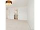Bedroom with a doorway leading to an en-suite bathroom at 695 S Alton Way # 9C, Denver, CO 80247