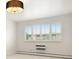 Bedroom features plantation shutters and neutral walls and carpet at 695 S Alton Way # 9C, Denver, CO 80247