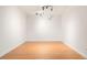 Bedroom features light hardwood floors and contemporary lighting at 695 S Alton Way # 9C, Denver, CO 80247