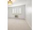 Bedroom features neutral carpet, white walls, and a window with wooden blinds at 695 S Alton Way # 9C, Denver, CO 80247