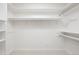 Walk-in closet with ample shelving and hanging space at 695 S Alton Way # 9C, Denver, CO 80247