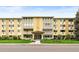 Apartment building exterior with well-kept lawns and mature trees providing a pleasant view at 695 S Alton Way # 9C, Denver, CO 80247