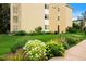Well-maintained grassy areas and flowering plants surrounding the building's exterior at 695 S Alton Way # 9C, Denver, CO 80247