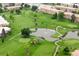 Beautiful aerial shot of a verdant golf course with water features and surrounding residential buildings at 695 S Alton Way # 9C, Denver, CO 80247