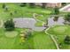 Scenic aerial view of a lush golf course with ponds, mature trees, and well-manicured greens at 695 S Alton Way # 9C, Denver, CO 80247