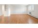 Bright living room features a built-in shelving and shuttered windows at 695 S Alton Way # 9C, Denver, CO 80247