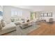 Spacious living room with a view to the outside and comfortable white seating at 695 S Alton Way # 9C, Denver, CO 80247