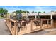 Inviting patio with tables, chairs, umbrellas, and a pergola, perfect for outdoor dining and relaxation at 695 S Alton Way # 9C, Denver, CO 80247