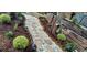Landscaped backyard featuring stone and mulch walkways with garden edging and solar lighting at 6233 W 75Th Ave, Arvada, CO 80003