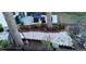 Professionally landscaped backyard with stone path, decorative mulch, and privacy landscaping at 6233 W 75Th Ave, Arvada, CO 80003