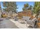 Backyard with patio featuring stylish outdoor furniture, dining area and lush landscaping perfect for entertaining at 6233 W 75Th Ave, Arvada, CO 80003