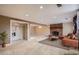 Finished basement with a brick fireplace, cozy seating, and ample space for entertainment at 6233 W 75Th Ave, Arvada, CO 80003