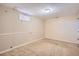Finished basement room with carpet, one window, neutral walls, and door to an adjacent room at 6233 W 75Th Ave, Arvada, CO 80003