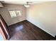 An empty bedroom with hardwood floors and a window provides a blank canvas for personalization at 6233 W 75Th Ave, Arvada, CO 80003
