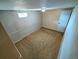 Cozy bedroom features neutral walls, carpeted floor, natural light, and a door at 6233 W 75Th Ave, Arvada, CO 80003