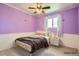 Bright bedroom offers ample natural light, hardwood-style flooring, and ample space at 6233 W 75Th Ave, Arvada, CO 80003