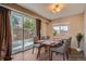 Inviting dining area with sliding door and ample natural light provides a relaxing atmosphere at 6233 W 75Th Ave, Arvada, CO 80003